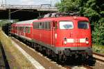 Die 110 416-5 mit einem RE aufgenommen in Kelsterbach am 13.07.2010.