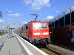 111 119 schiebt den RE 9 (KBS460) in Troisdorf am 06.Aug.2010 weiter in Richtung K�ln.